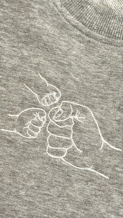 The Fist Bump Sweater